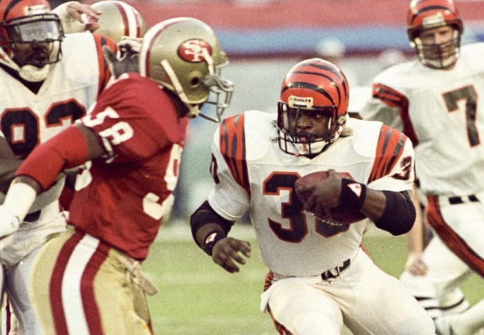 Cincinnati Bengals running back Ickey Woods (30) carries the ball against the San Francisco 49ers during Super Bowl XXIII at Joe Robbie Stadium. The 49ers defeated the Bengals 20-16.